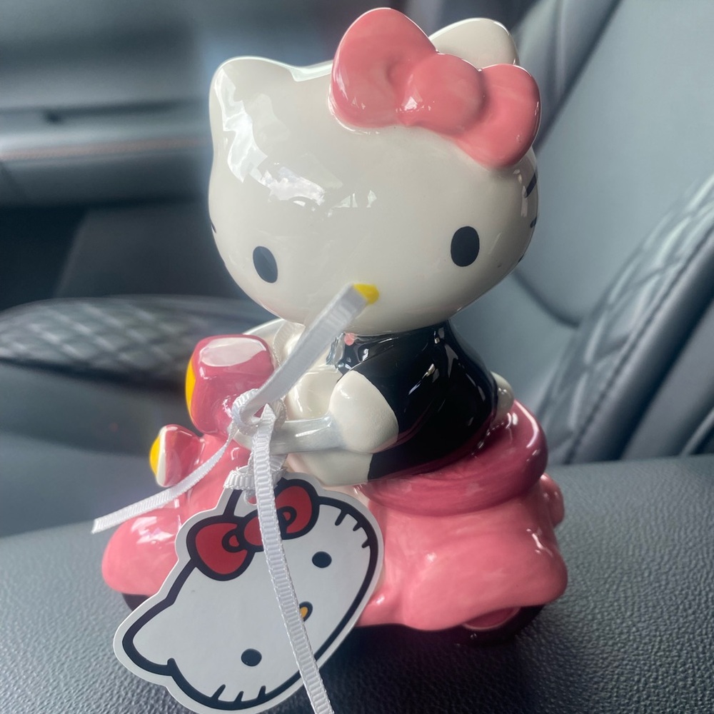 Hello kitty on scooter ceramic